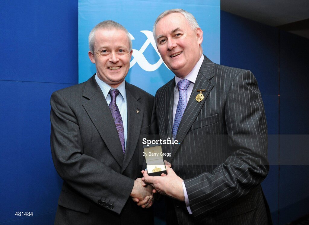15 January 2011; Referee Thomas Quigley, from Co. Dublin, who refereed the AIB GAA Football All-Ireland Intermediate Club Championship 2009/2010, is presented with his  referee's award by Uachtarán CLG Criostóir Ó Cuana. 2010 National Referees' Awards Banquet, Croke Park, Dublin. Picture credit: Barry Cregg / SPORTSFILE