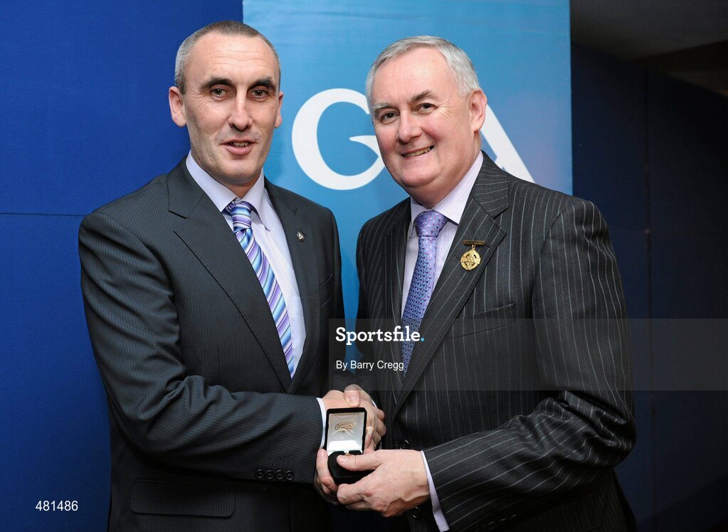 15 January 2011; Referee Declan Magee, from Co. Down, who refereed the Allianz GAA Hurling National League Division 3B, is presented with his  referee's award by Uachtarán CLG Criostóir Ó Cuana. 2010 National Referees' Awards Banquet, Croke Park, Dublin. Picture credit: Barry Cregg / SPORTSFILE