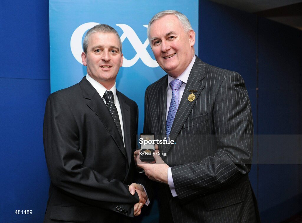 15 January 2011; Referee Johnny Ryan, from Co. Tipperary, who refereed the Allianz GAA Hurling National League Division 2, is presented with his  referee's award by Uachtarán CLG Criostóir Ó Cuana. 2010 National Referees' Awards Banquet, Croke Park, Dublin. Picture credit: Barry Cregg / SPORTSFILE