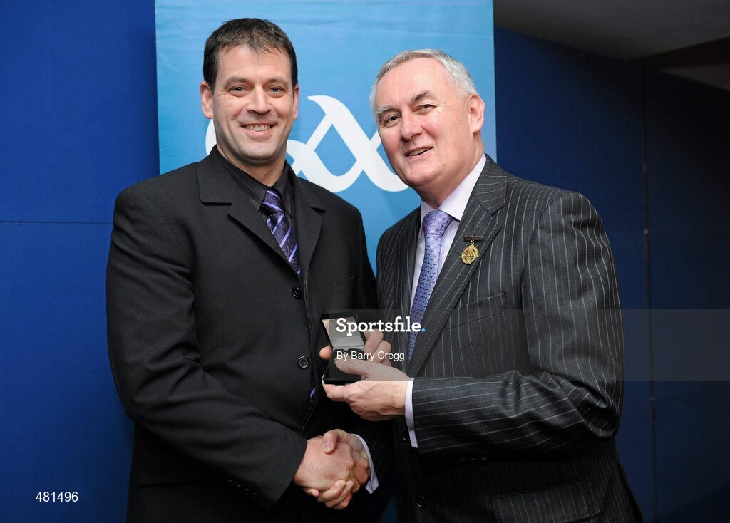 15 January 2011; Referee Damien Brazil, from Co. Offaly, who refereed the GAA Football All-Ireland Junior Championship, is presented with his  referee's award by Uachtarán CLG Criostóir Ó Cuana. 2010 National Referees' Awards Banquet, Croke Park, Dublin. Picture credit: Barry Cregg / SPORTSFILE