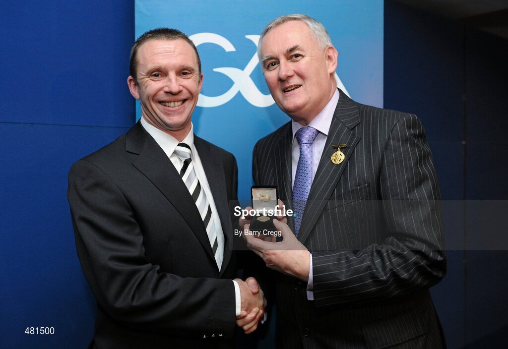 15 January 2011; Referee Michael Duffy, from Co. Sligo, who refereed the ESB GAA Football All-Ireland Minor Championship, is presented with his  referee's award by Uachtarán CLG Criostóir Ó Cuana. 2010 National Referees' Awards Banquet, Croke Park, Dublin. Picture credit: Barry Cregg / SPORTSFILE