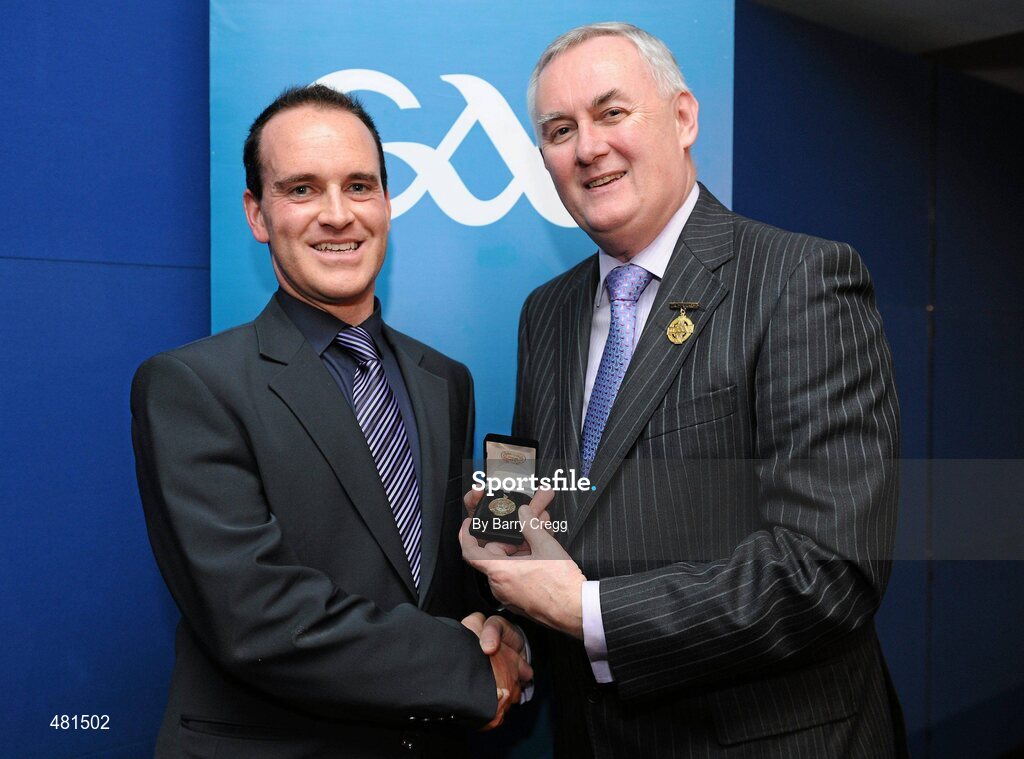 15 January 2011; Referee David Coldrick, from Co. Meath, who refereed the GAA Football All-Ireland Senior Championship, is presented with his  referee's award by Uachtarán CLG Criostóir Ó Cuana. 2010 National Referees' Awards Banquet, Croke Park, Dublin. Picture credit: Barry Cregg / SPORTSFILE