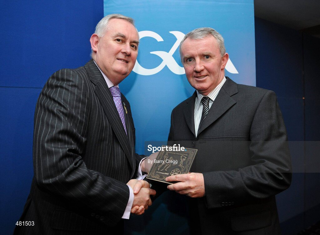 15 January 2011; Retiring referee Paul Finegan, from Co. Louth, is presented with his  referee's award by Uachtarán CLG Criostóir Ó Cuana. 2010 National Referees' Awards Banquet, Croke Park, Dublin. Picture credit: Barry Cregg / SPORTSFILE