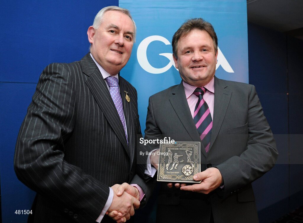 15 January 2011; Retiring referee Tom Lynch, from Co. Kerry, is presented with his  referee's award by Uachtarán CLG Criostóir Ó Cuana. 2010 National Referees' Awards Banquet, Croke Park, Dublin. Picture credit: Barry Cregg / SPORTSFILE