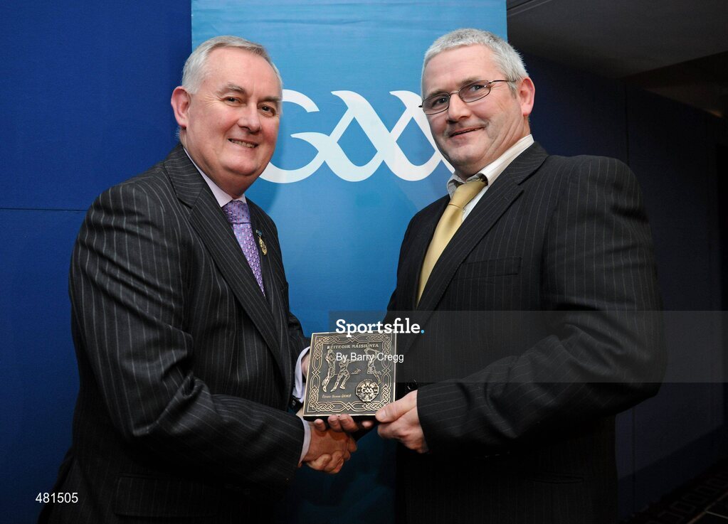 15 January 2011; Retiring referee Haulie Beirne, from Co. Roscommon, is presented with his  referee's award by Uachtarán CLG Criostóir Ó Cuana. 2010 National Referees' Awards Banquet, Croke Park, Dublin. Picture credit: Barry Cregg / SPORTSFILE