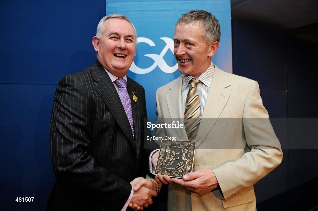 15 January 2011; Retiring referee Denis Richardson, from Co. Limerick, is presented with his  referee's award by Uachtarán CLG Criostóir Ó Cuana. 2010 National Referees' Awards Banquet, Croke Park, Dublin. Picture credit: Barry Cregg / SPORTSFILE