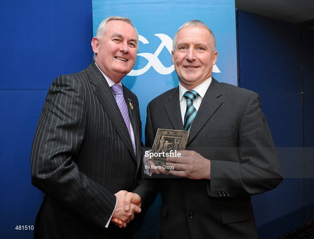 15 January 2011; Retiring referee Gerard Devlin, from Co. Armagh, is presented with his  referee's award by Uachtarán CLG Criostóir Ó Cuana. 2010 National Referees' Awards Banquet, Croke Park, Dublin. Picture credit: Barry Cregg / SPORTSFILE