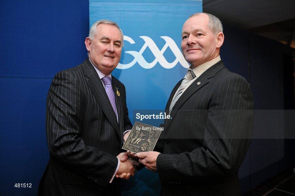 15 January 2011; Retiring referee Martin Mulholland, from Co. Derry, is presented with his  referee's award by Uachtarán CLG Criostóir Ó Cuana. 2010 National Referees' Awards Banquet, Croke Park, Dublin. Picture credit: Barry Cregg / SPORTSFILE