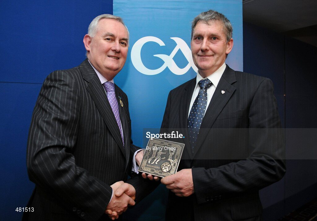 15 January 2011; Retiring referee Hugh Pat McCusker, from Co. Down, is presented with his  referee's award by Uachtarán CLG Criostóir Ó Cuana. 2010 National Referees' Awards Banquet, Croke Park, Dublin. Picture credit: Barry Cregg / SPORTSFILE