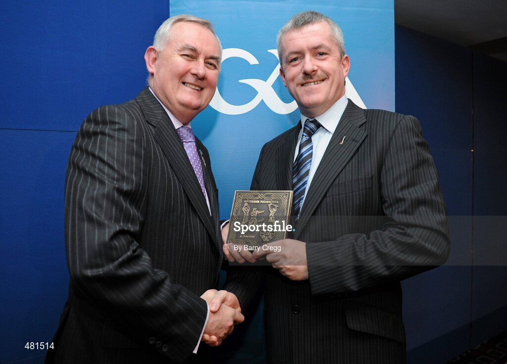 15 January 2011; Retiring referee Joe Kelly, from Co. Wexford, is presented with his  referee's award by Uachtarán CLG Criostóir Ó Cuana. 2010 National Referees' Awards Banquet, Croke Park, Dublin. Picture credit: Barry Cregg / SPORTSFILE