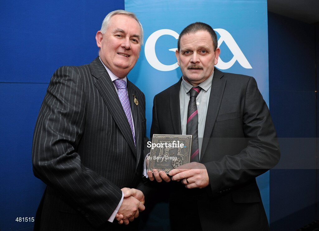15 January 2011; Retiring referee John Healy, from Co. Clare, is presented with his  referee's award by Uachtarán CLG Criostóir Ó Cuana. 2010 National Referees' Awards Banquet, Croke Park, Dublin. Picture credit: Barry Cregg / SPORTSFILE