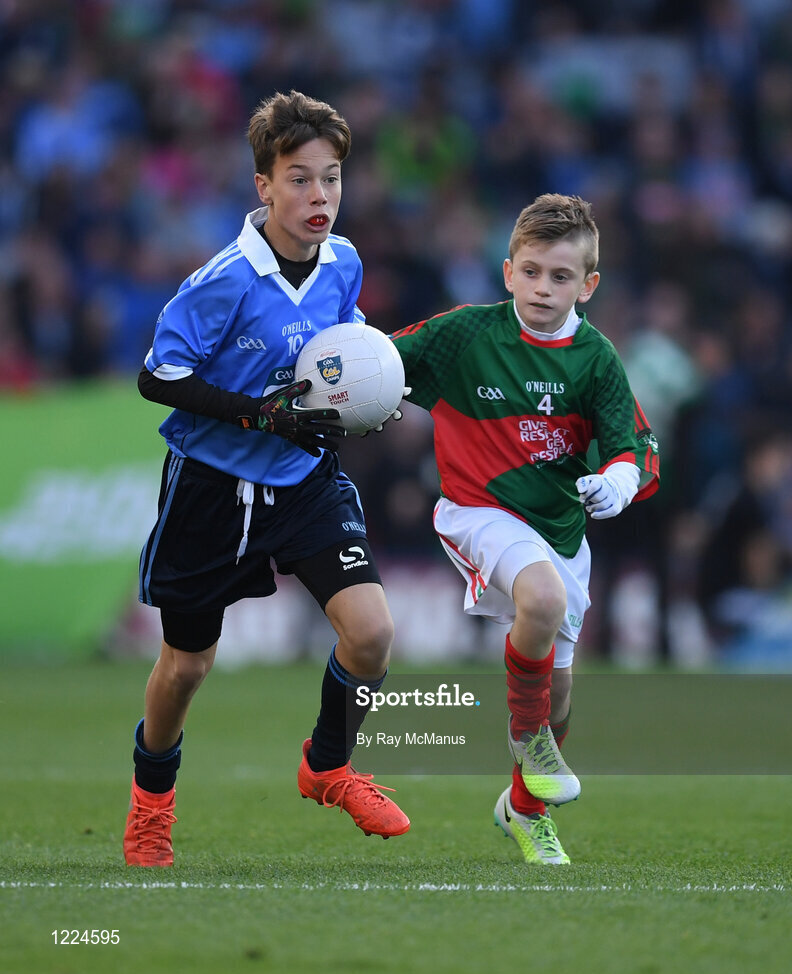 1 October 2016; Alex Drycher, Bayside NS, Sutton, Dublin, in action against Oisín Cronin, Craggagh NS, Kiltimagh, Mayo, during the INTO Cumann na mBunscol GAA Respect Exhibition Go Games at the GAA Football All-Ireland Senior Championship Final Replay match between Dublin and Mayo at Croke Park in Dublin. Photo by Ray McManus/Sportsfile