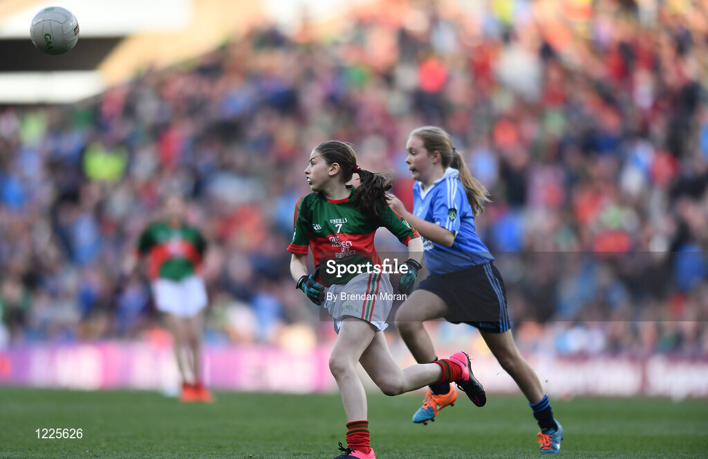 1 October 2016; Deirbhile Horkan, Meelickmore NS, Claremorris, Mayo, in action against Ellie Collender, St Brigid's GNS, Palmerstown, Dublin, during the INTO Cumann na mBunscol GAA Respect Exhibition Go Games at the GAA Football All-Ireland Senior Championship Final Replay match between Dublin and Mayo at Croke Park in Dublin. Photo by Brendan Moran/Sportsfile