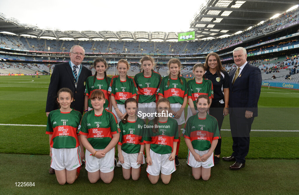 1 October 2016; Mini-Sevens Coordinator Gerry O'Meara, Uachtarán Chumann Lúthchleas Gaeil Aogán Ó Fearghail, with the Mayo team, back row, Emma Murray, Fahy NS, Newport, Mayo, Grace Naughton, Currabaggan NS, Knockmore, Mayo, Grace Shannon, Melview National School, Longford, Nikita Tighe, St Joseph's NS, Bekan, Mayo, Deirbhile Horkan, Meelickmore NS, Claremorris, Mayo, front row, left to right, Kevina Walsh, St Attracta's NS, Charlestown, Mayo, Amy Forkan, St Joseph's NS, Midfield, Mayo, Muireann Cogan, St Angela's NS, Castlebar, Mayo, Molly McManamon, Drumgallagh NS, Ballycroy, Mayo, Chloe McDonnell, Binghamstown NS, Belmullet, Mayo, ahead of the GAA Football All-Ireland Senior Championship Final Replay match between Dublin and Mayo at Croke Park in Dublin. Photo by Daire Brennan/Sportsfile