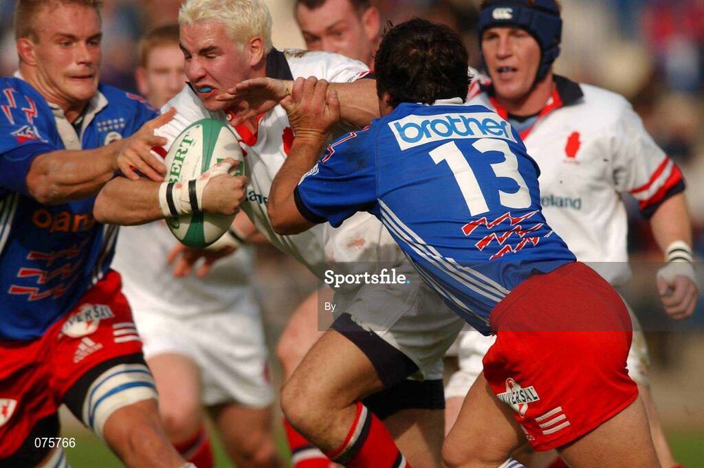 27 October 2001; Paddy Wallace, Ulster, is tackled by Mike James and Franck Comba,13, Stade Francais. Stade Francais v Ulster, Heineken Cup,  Stade Jean Bouin, Paris, France. Rugby. Picture credit; Matt Browne / SPORTSFILE  *EDI*