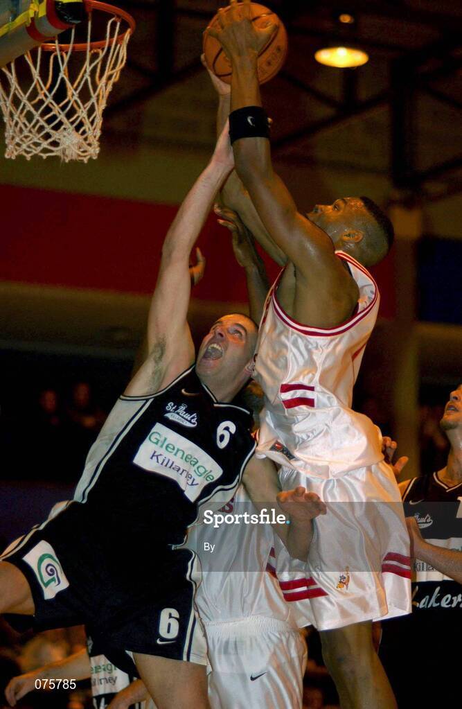 27 October 2001; Jermaine Turner, Frosties Tigers, goes for a basket ahead of Vince Daly (6), Gleneagle Killarney. Frosties Tigers v Gleneagle Killarney, ESB Superleague Basketball, Tralee Sports Centre, Tralee, Co. Kerry. Picture credit; Brendan Moran / SPORTSFILE *EDI*