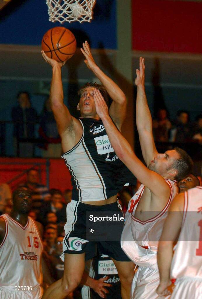 27 October 2001; Billy Gilligan, Gleneagle Killarney, shoots for a basket ahead of Paul Willscroft, Frosties Tigers. Frosties Tigers v Gleneagle Killarney, ESB Superleague Basketball, Tralee Sports Centre, Tralee, Co. Kerry. Picture credit; Brendan Moran / SPORTSFILE *EDI*