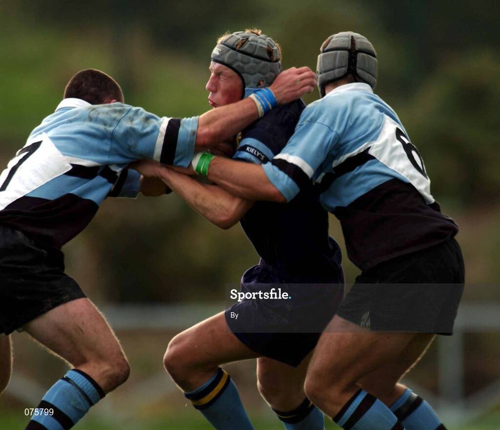 27 October 2001; Eoghan Hickey, UCD, is tackled by Galwegians players Ivan Muldoon and John Muldoon (6). UCD v Galwegians, AIB League Division 1, Belfield Bowl, Belfield, Dublin. Rugby. Picture credit; Ray McManus / SPORTSFILE *EDI*