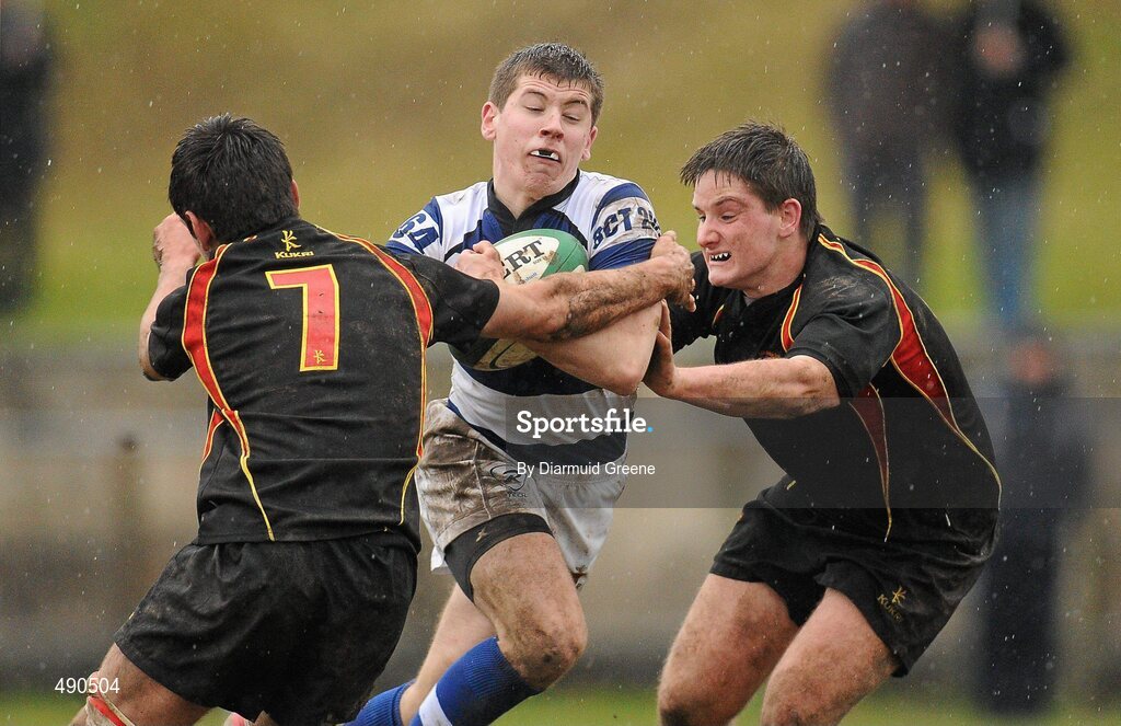 16 February 2011; Killian Kiely, Rockwell College, is tackled by Peter Hodnett, left, and Gavin Doherty, Ardscoil Ris. Avonmore Milk Munster Schools Senior Cup, Ardscoil Ris v Rockwell College, Clanwilliam RFC, Tipperary Town, Tipperary. Picture credit: Diarmuid Greene / SPORTSFILE