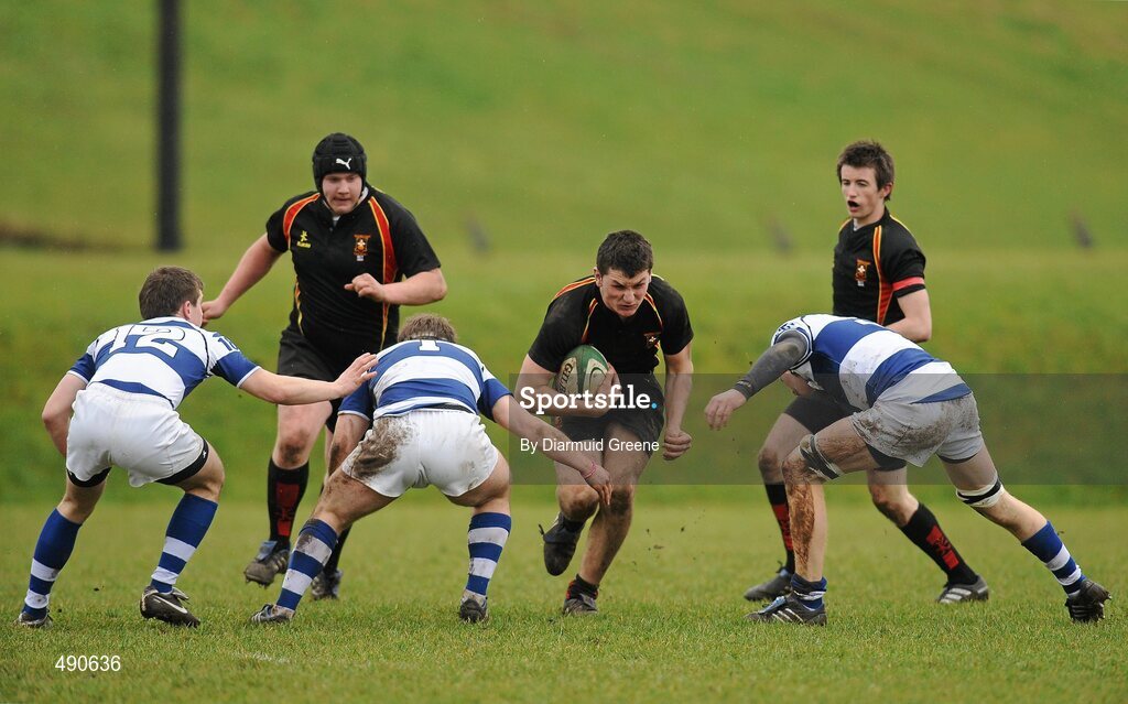 16 February 2011; Peter McGann, supported by Brian Masterson, left, and Sean Noonan, Ardscoil Ris, is tackled by Aidan o'Sullivan, right, Cian O'Donnell, and Killian Kiely, left, Rockwell College. Avonmore Milk Munster Schools Senior Cup, Ardscoil Ris v Rockwell College, Clanwilliam RFC, Tipperary Town, Tipperary. Picture credit: Diarmuid Greene / SPORTSFILE