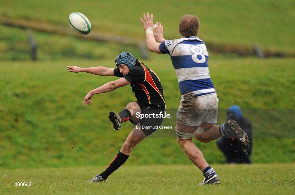 16 February 2011; Rory Collins, Ardscoil Ris, is tackled by Luke Cahill, Rockwell College. Avonmore Milk Munster Schools Senior Cup, Ardscoil Ris v Rockwell College, Clanwilliam RFC, Tipperary Town, Tipperary. Picture credit: Diarmuid Greene / SPORTSFILE