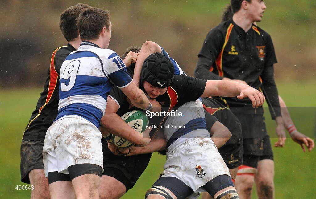 16 February 2011; Brian Masterson, Ardscoil Ris, is tackled by Sonny Dwyer, and Brian Haugh, left, Rockwell College. Avonmore Milk Munster Schools Senior Cup, Ardscoil Ris v Rockwell College, Clanwilliam RFC, Tipperary Town, Tipperary. Picture credit: Diarmuid Greene / SPORTSFILE