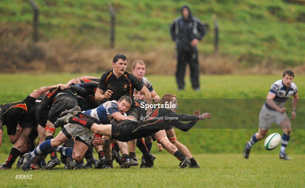 16 February 2011; Conor McLoughlin, Ardscoil Ris, gets his pass away despite the efforts of Brian Haugh, Rockwell College. Avonmore Milk Munster Schools Senior Cup, Ardscoil Ris v Rockwell College, Clanwilliam RFC, Tipperary Town, Tipperary. Picture credit: Diarmuid Greene / SPORTSFILE