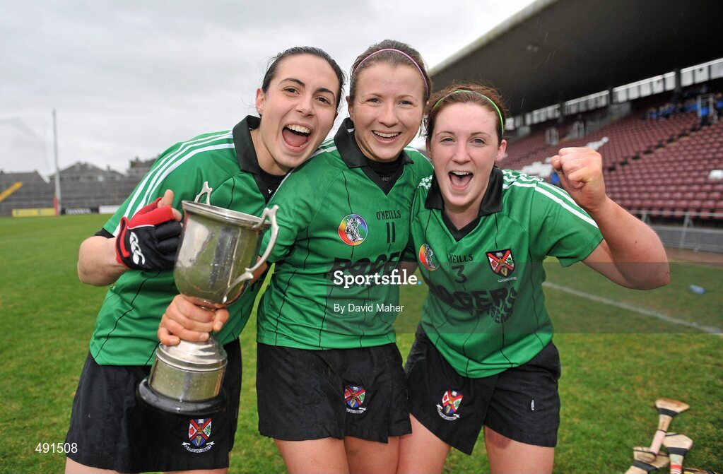 20 February 2011; Queens University Belfast players, left to right, Mairead Short, Collette McSoley and Anne McGuigan celebrate with the cup. Purcell Cup Final, DCU v Queens University Belfast, Pearse Stadium, Salthill, Galway. Picture credit: David Maher / SPORTSFILE