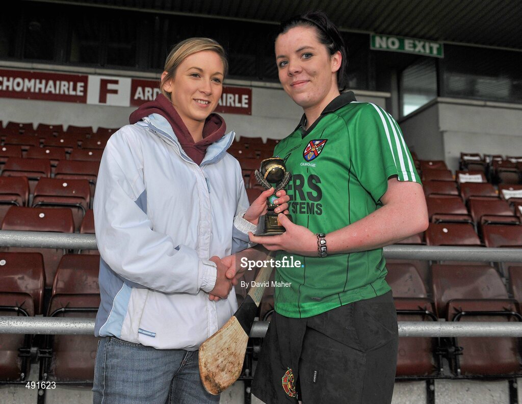 20 February 2011; Keelin Bradley, right, Queens University Belfast, is presented with the player of the match award by Niamh Kilkenny. Purcell Cup Final, DCU v Queens University Belfast, Pearse Stadium, Salthill, Galway. Picture credit: David Maher / SPORTSFILE