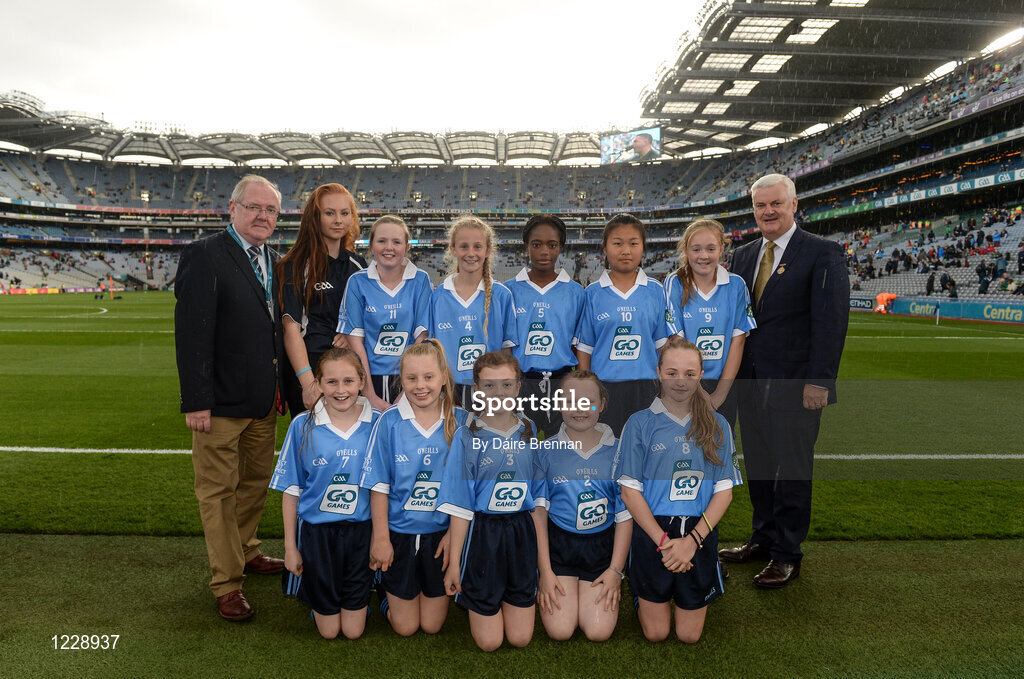 1 October 2016; Mini-Sevens co-ordinator Gerry O'Meara, Uachtarán Chumann Luthchleas Gaeil Aogán Ó Fearghail, with the Dublin team, back row, Ciara Doyle, Stars of Erin GAA, Glencullen, Dublin, Suzy Lehane, Kilmacud Crokes GAA, Stillorgan, Dublin, Golden Akpaloo, St John The Evangelist NS, Adamstown, Dublin, Kiki Ren, Maynooth GAA, Maynooth, Kildare, Ellie Collender, St Brigid's GNS, Palmerstown, Dublin, front row, left to right, Aisling Roebuck, Round Towers GAA, Clondalkin, Dublin, Síofra Kelly, Scoil Naomh Pádraig, Ballyroan, Dublin, Ella O'Connell, Cuala GAA, Dalkey, Dublin, Líle O'Connor, Fingallians GAA, Swords, Dublin, Áine Rafter, Loreto Primary School, Rathfarnham, Dublin, ahead of the GAA Football All-Ireland Senior Championship Final Replay match between Dublin and Mayo at Croke Park in Dublin. Photo by Daire Brennan/Sportsfile