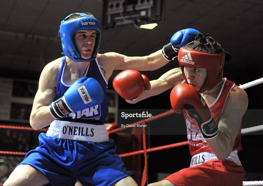 25 February 2011; Michael Conlan, St. John's Bosco Boxing Club, exchanges punches with Cristopher Phelan, right, Ryston Boxing Club, during their 52kg division bout. National Boxing Championship Finals, National Stadium, Dublin. Picture credit: David Maher / SPORTSFILE