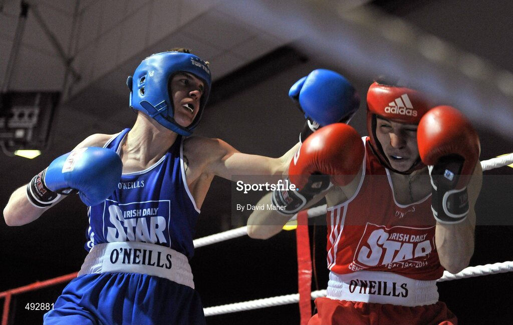 25 February 2011; Michael Conlan, St.John's Bosco Boxing Club, exchanges punches with Christopher Phelan, left, Ryston Boxing Club, during their 52kg division bout. National Boxing Championship Finals, National Stadium, Dublin. Picture credit: David Maher / SPORTSFILE