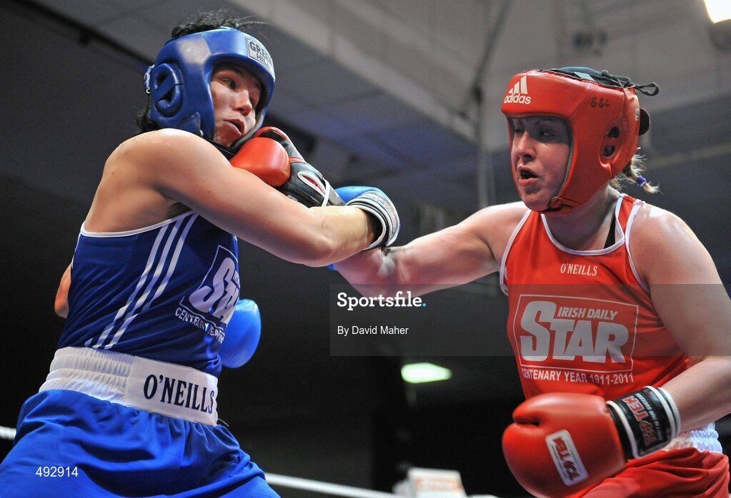 25 February 2011; Patrica Roddy, right, Bray Boxing Club, exchanges punches with Sinead Kavanagh, Drimnagh Boxing Club, during their 75kg division bout. National Boxing Championship Finals, National Stadium, Dublin. Picture credit: David Maher / SPORTSFILE