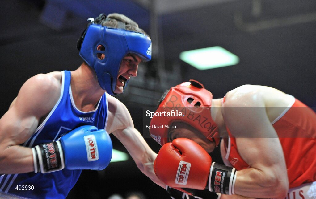 25 February 2011; Karl Brabazon, right, St. Saviours Boxing Club, exchanges punches with Adam Nolan, Bray  Boxing Club, during their 69kg division bout. National Boxing Championship Finals, National Stadium, Dublin. Picture credit: David Maher / SPORTSFILE