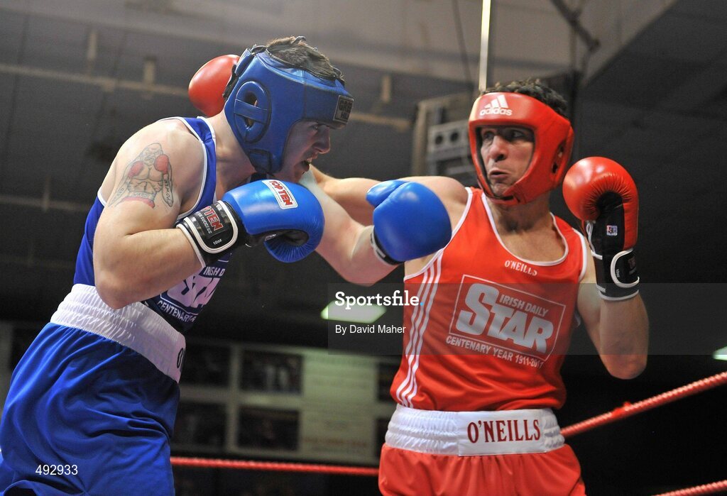 25 February 2011; Kenneth Egan, right, Neiltowns Boxing Club, exchanges punches with Joe Ward, Moate Boxing Club, during their 75kg division bout. National Boxing Championship Finals, National Stadium, Dublin. Picture credit: David Maher / SPORTSFILE