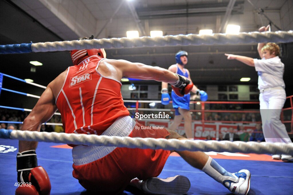 25 February 2011; Kenneth Egan, Neiltowns Boxing Club, is knocked down in the third round by Joe Ward, Moate Boxing Club, during their 75kg division bout. National Boxing Championship Finals, National Stadium, Dublin. Picture credit: David Maher / SPORTSFILE