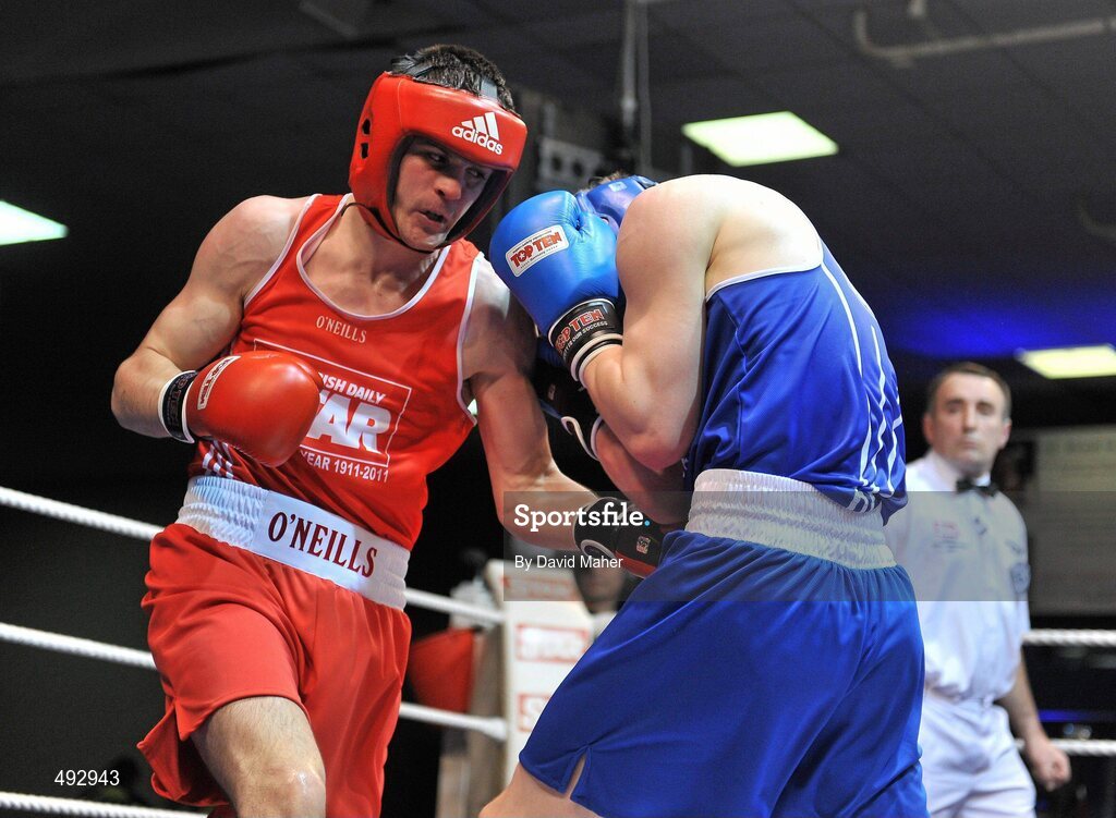 25 February 2011; Darren O'Neill, left, Paulstown Boxing Club, exchanges punches with Jason Quigley, Finn Valley Boxing Club, during their 75kg division bout. National Boxing Championship Finals, National Stadium, Dublin. Picture credit: David Maher / SPORTSFILE
