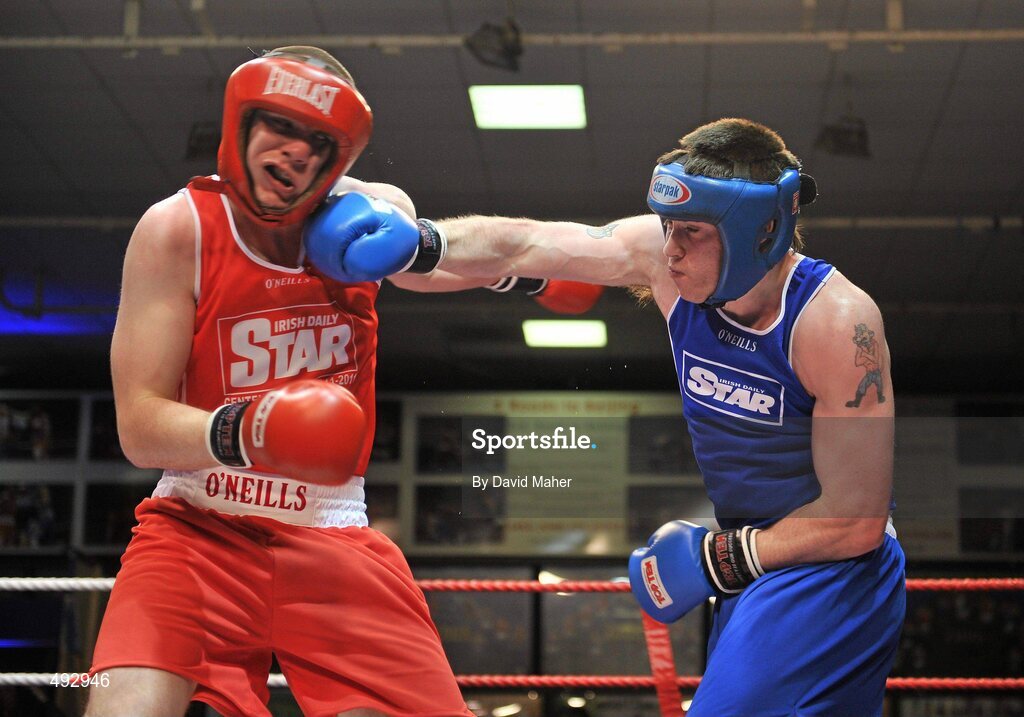 25 February 2011; Con Sheehan, left, Clonmel Boxing Club, exchanges punches with Patrick Corcoran, Olympic Boxing Club, during their 91kg division bout. National Boxing Championship Finals, National Stadium, Dublin. Picture credit: David Maher / SPORTSFILE