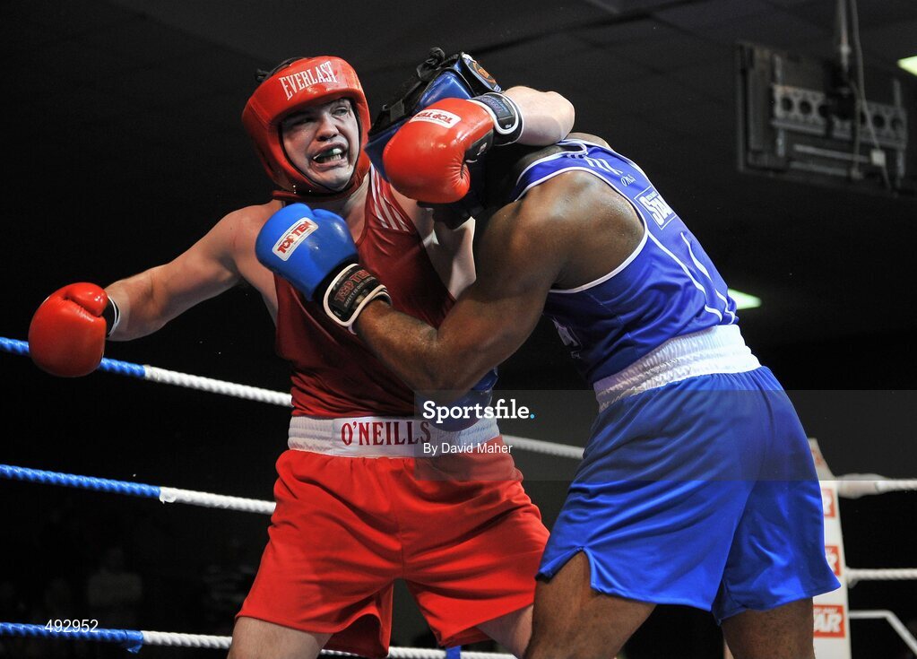 25 February 2011; Cathal McMonaghle, left, Holy Trinity boxing club, exchanges punches with Kenneth Okungbowa, Athlone boxing Club, Athy, during their 91kg division bout. National Boxing Championship Finals, National Stadium, Dublin. Picture credit: David Maher / SPORTSFILE