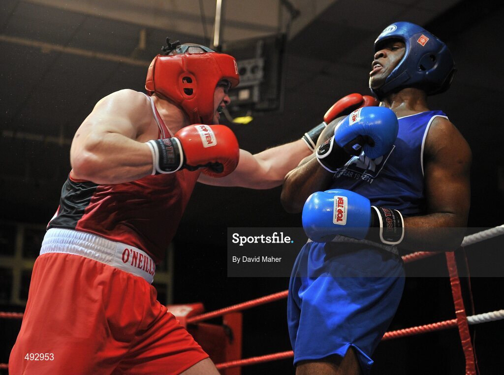 25 February 2011; Cathal McMonaghle, left, Holy Trinity boxing club, exchanges punches with Kenneth Okungbowa, Athlone boxing Club, Athy, during their 91kg division bout. National Boxing Championship Finals, National Stadium, Dublin. Picture credit: David Maher / SPORTSFILE