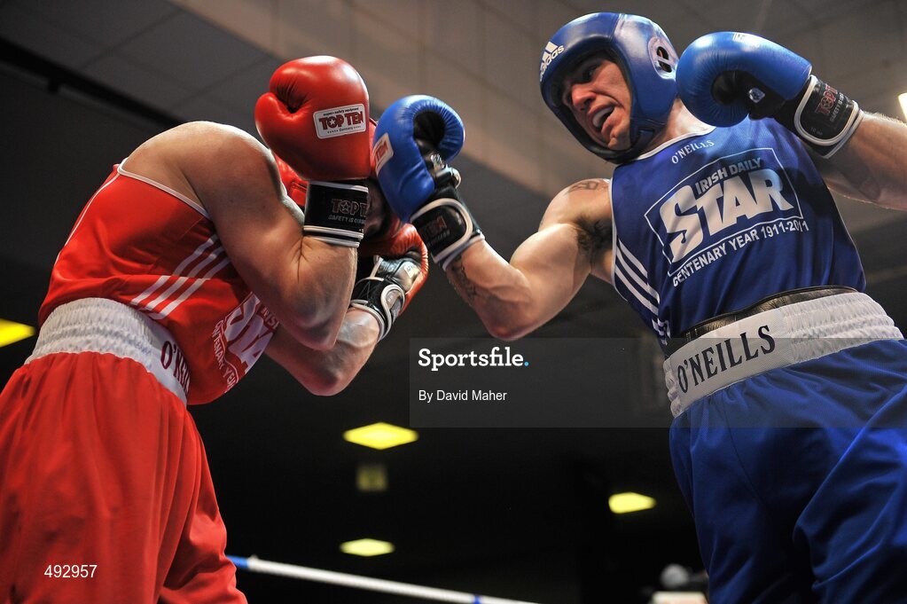 25 February 2011; Michael McDonagh, left, St. Mary's boxing club, exchanges punches with David Oliver Joyce, St. Michael's boxing Club, Athy, during their 60kg division bout. National Boxing Championship Finals, National Stadium, Dublin. Picture credit: David Maher / SPORTSFILE