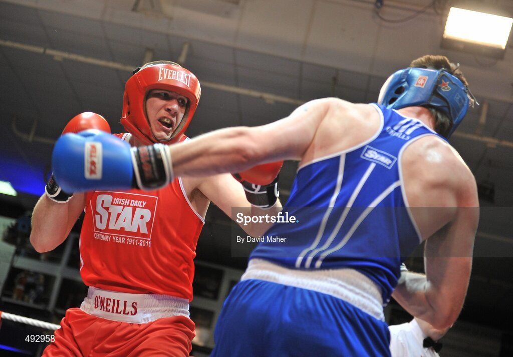 25 February 2011; Con Sheehan, left, Clonmel boxing club, exchanges punches with Patrick Corcoran, Olympic boxing Club, during their 91kg division bout. National Boxing Championship Finals, National Stadium, Dublin. Picture credit: David Maher / SPORTSFILE