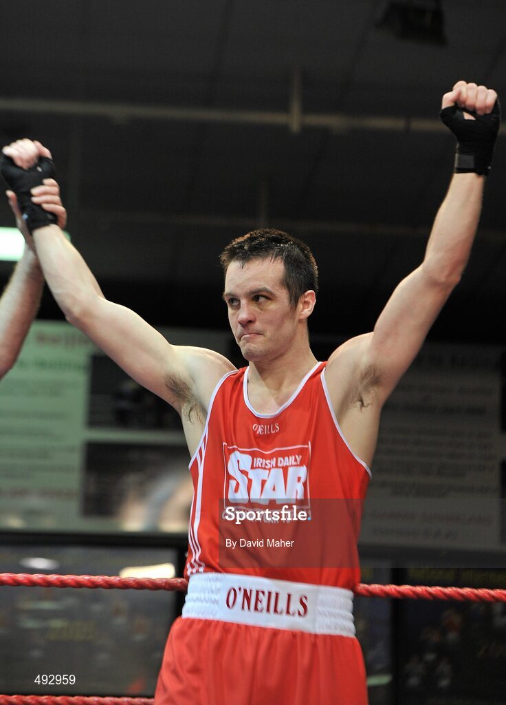 25 February 2011; Darren O'Neill, Paulstown boxing club, celebrates after victory over Jason Quigley, Finn Valley boxing Club, during their 75kg division bout. National Boxing Championship Finals, National Stadium, Dublin. Picture credit: David Maher / SPORTSFILE