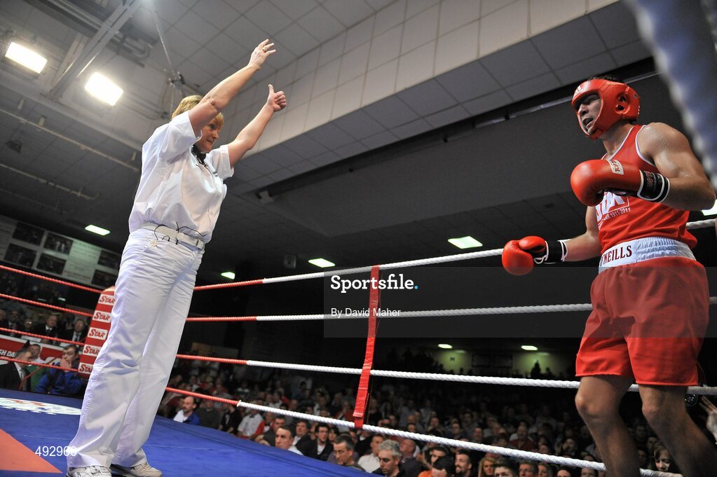25 February 2011; Referee Sadie Duffy, gives a count to Kenneth Egan, Neiltowns boxing club during the third round against Joe Ward, Moate boxing Club, during their 75kg division bout. National Boxing Championship Finals, National Stadium, Dublin. Picture credit: David Maher / SPORTSFILE