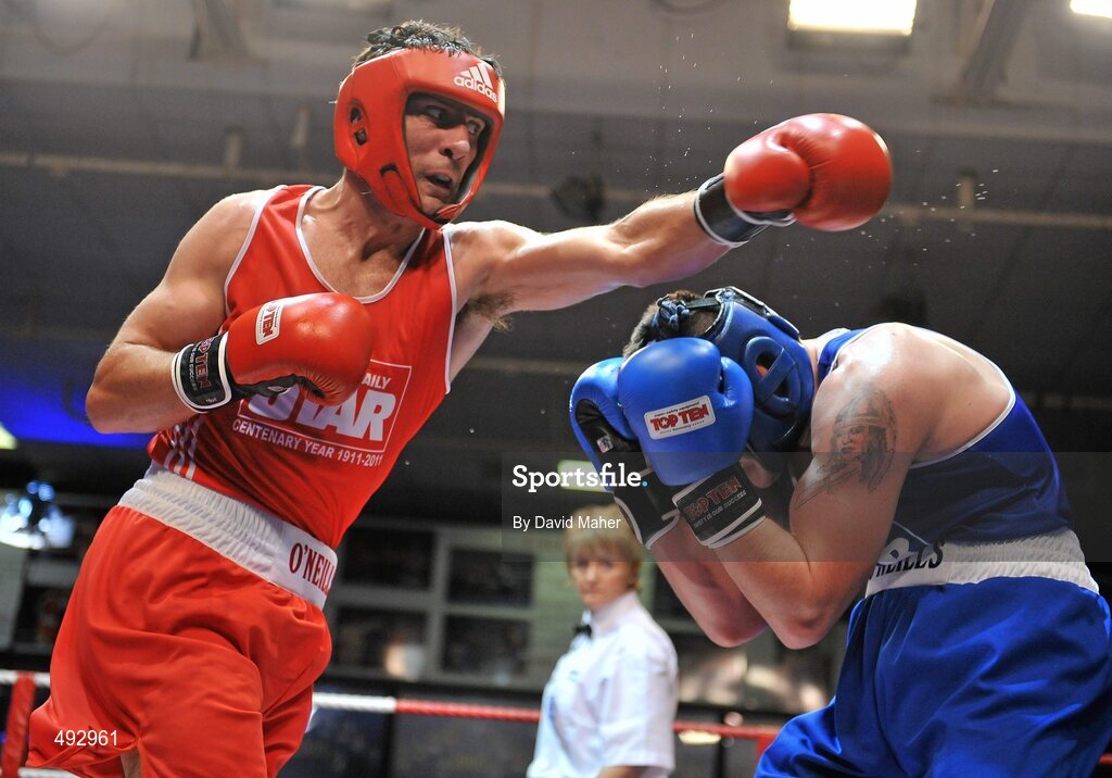 25 February 2011; Kenneth Egan, left, Neiltowns boxing club, exchanges punches with Joe Ward, Moate boxing Club, during their 75kg division bout. National Boxing Championship Finals, National Stadium, Dublin. Picture credit: David Maher / SPORTSFILE