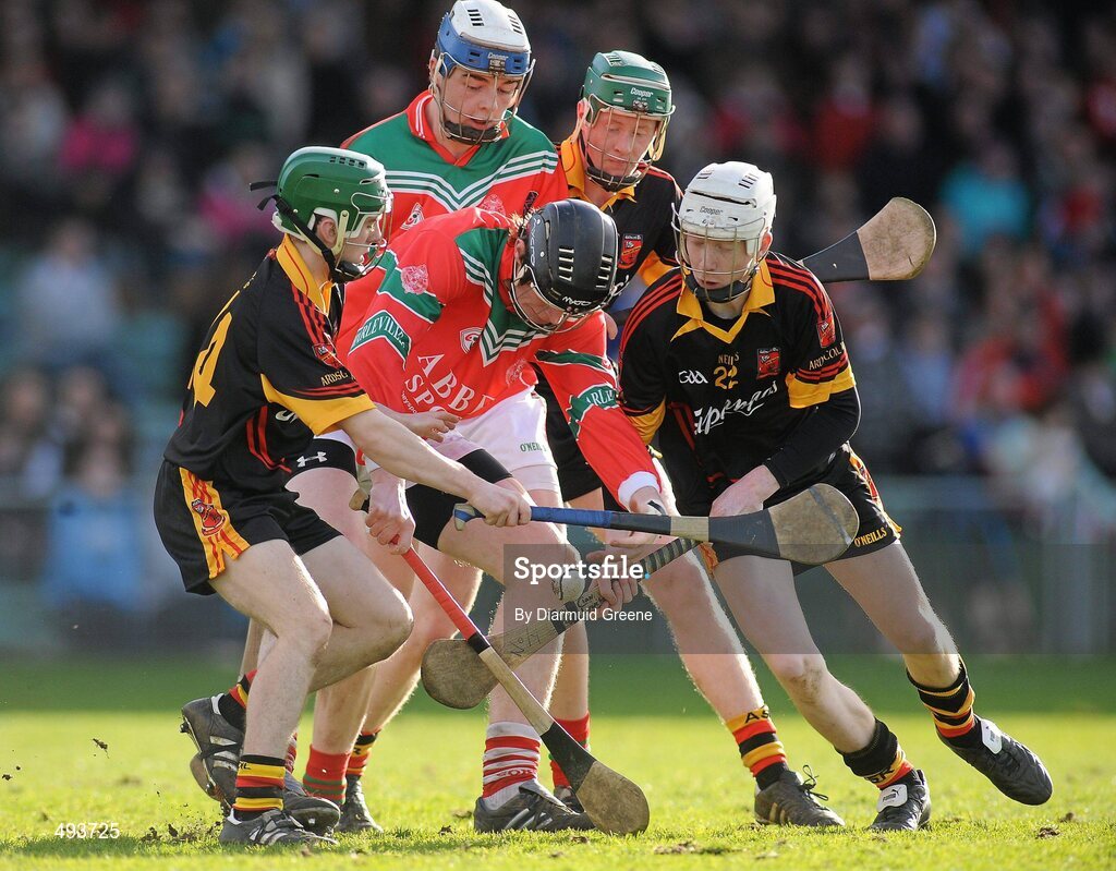 27 February 2011; John Madigan, supported by David Reidy, Charleville CBS, in action against Oisin Hickey, left, Jamie Shanahan, and Cian Lynch, right, Ardscoil Ris. Dr. Harty Cup Final, Ardscoil Ris v Charleville CBS, Gaelic Grounds, Limerick. Picture credit: Diarmuid Greene / SPORTSFILE