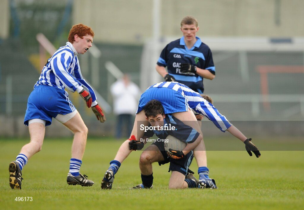 8 March 2011; Blane Rigney, Gallen Community School, Ferbane, Co. Offaly, gets out from underneath Brendan McCrea, Colaiste Bhride Carnew, Co. Wicklow as Niall Dempsey, left, closes in. Leinster Vocational Schools Senior Football “A” Final, Colaiste Bhride Carnew, Co. Wicklow v Gallen Community School, Ferbane, Co. Offaly, O’Moore Park, Portlaoise, Co. Laois. Picture credit: Barry Cregg / SPORTSFILE