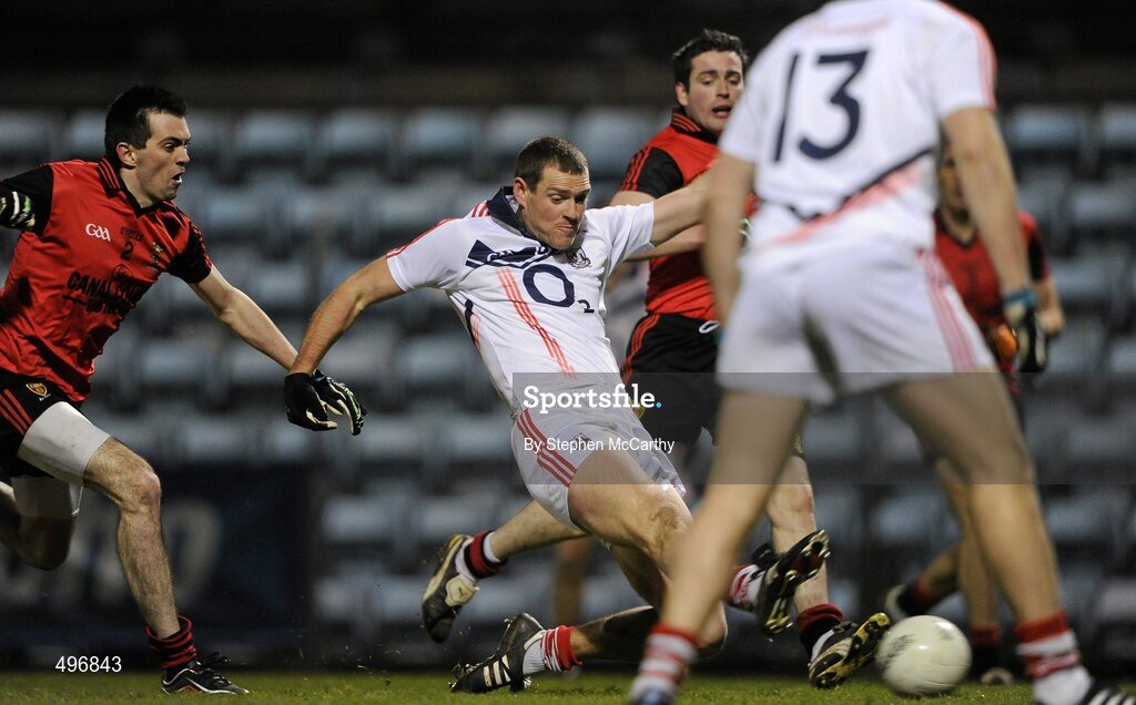 12 March 2011; Pearse O'Neill, Cork, shoots to score his side's first goal despite the efforts of Gerald McCartan, left, and Kevin McKernan, Down. Allianz Football League, Division 1, Round 4, Cork v Down, Pairc Ui Rinn, Cork. Picture credit: Stephen McCarthy / SPORTSFILE