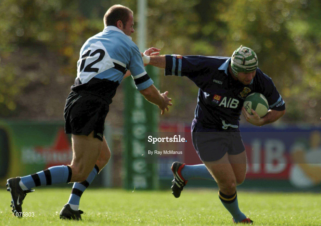 27 October 2001; Shane Moore of UCD is tackled by Mervyn Murphy of Galwegians during the AIB League Division 1 match between UCD and Galwegians at Belfield Bowl in Dublin. Photo by Ray McManus/Sportsfile