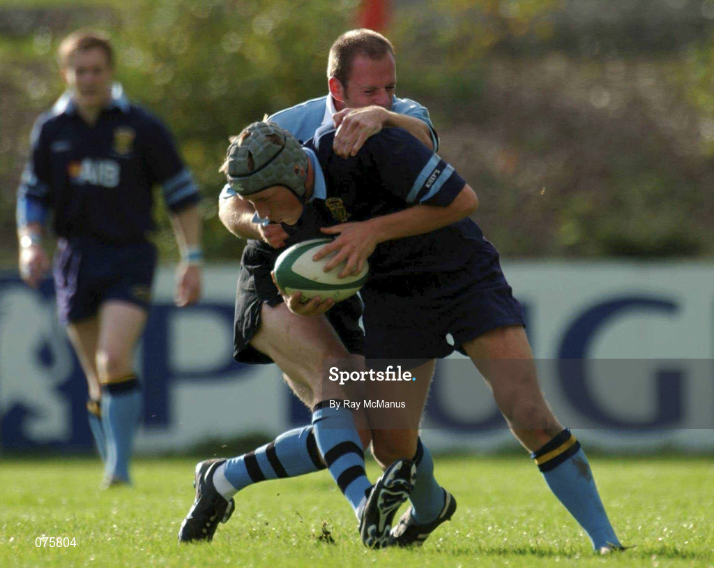 27 October 2001; Eoghan Hickey of UCD is tackled by Mervyn Murphy of Galwegians during the AIB League Division 1 match between UCD and Galwegians at Belfield Bowl in Dublin. Photo by Ray McManus/Sportsfile